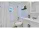Modern bathroom showcasing patterned wallpaper and a bathtub with shower at 3226 Helen Ave, Orlando, FL 32804