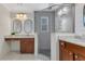 Bathroom showcasing dual vanity with marble countertop, vessel sinks, and a glass shower at 3226 Helen Ave, Orlando, FL 32804