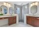 Bathroom showcasing dual vanity with marble countertop, vessel sinks, and a glass shower at 3226 Helen Ave, Orlando, FL 32804