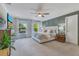 Bedroom featuring an accent wall, two nightstands with lamps, and windows letting in plenty of natural light at 3226 Helen Ave, Orlando, FL 32804