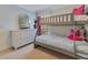 Charming bedroom featuring a bunk bed and a dresser with a decorative mirror at 3226 Helen Ave, Orlando, FL 32804