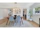 Dining area features a modern table, stylish light fixture, and seamless flow into other living spaces at 3226 Helen Ave, Orlando, FL 32804