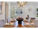 Dining room featuring a wood table, decorative lighting, and natural accents at 3226 Helen Ave, Orlando, FL 32804