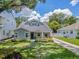 Charming craftsman home with lush lawn, landscaping, and a concrete driveway leading to the property at 3226 Helen Ave, Orlando, FL 32804