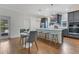 Well-appointed kitchen featuring a breakfast bar, stainless steel appliances, and a cozy dining area at 3226 Helen Ave, Orlando, FL 32804