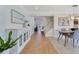Open-concept living space with wood floors and modern furnishings with staircase access at 3226 Helen Ave, Orlando, FL 32804