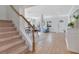 Open-concept living space with tile floors, staircase, dining area, sitting room, and bright white walls at 3226 Helen Ave, Orlando, FL 32804