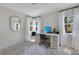 Bright home office with desk setup, contemporary decor, two windows and ample lighting at 3226 Helen Ave, Orlando, FL 32804