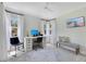 Bright home office with white desk setup, contemporary decor, and ample lighting at 3226 Helen Ave, Orlando, FL 32804