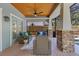 Screened-in patio with wicker furniture, a wood plank floor and a ceiling fan at 3226 Helen Ave, Orlando, FL 32804