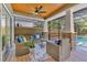 Outdoor screened-in patio with wicker furniture, ceiling fan and brick-based support columns at 3226 Helen Ave, Orlando, FL 32804