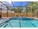 Sparkling pool features a waterfall and lush landscaping, ideal for outdoor enjoyment at 3226 Helen Ave, Orlando, FL 32804