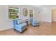 Cozy sitting area is illuminated by sun-filled windows, enhancing the serene ambiance at 3226 Helen Ave, Orlando, FL 32804