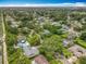An aerial view of a lush, green neighborhood with mature trees and homes, some featuring private pools at 404 Broadview Ave, Altamonte Springs, FL 32701