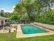 Private backyard featuring a pool, gazebo, and lush landscaping for a serene outdoor experience at 404 Broadview Ave, Altamonte Springs, FL 32701