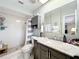 This bathroom features tile floors, a shower, and a vanity with a marble countertop at 404 Broadview Ave, Altamonte Springs, FL 32701