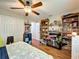 Bright bedroom with hardwood floors, ceiling fan, and playful decor and built-in shelving for display at 404 Broadview Ave, Altamonte Springs, FL 32701
