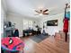 Versatile bonus room with hardwood floors, fitness equipment, and a comfortable chair at 404 Broadview Ave, Altamonte Springs, FL 32701
