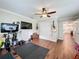 This exercise room features hardwood floors and a ceiling fan for a comfortable workout environment at 404 Broadview Ave, Altamonte Springs, FL 32701