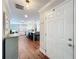 Inviting foyer showcases hardwood floors, leading into a spacious kitchen and living area at 404 Broadview Ave, Altamonte Springs, FL 32701