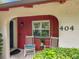 A cozy front porch with rocking chairs and potted plants, offering a welcoming entrance at 404 Broadview Ave, Altamonte Springs, FL 32701