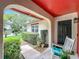 Inviting front porch with comfortable rocking chair and well-manicured landscaping at 404 Broadview Ave, Altamonte Springs, FL 32701