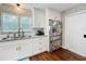 Bright kitchen features stainless appliances, granite countertops, and white cabinetry at 404 Broadview Ave, Altamonte Springs, FL 32701