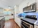 Beautiful kitchen with stainless steel appliances, granite counters, and white cabinets at 404 Broadview Ave, Altamonte Springs, FL 32701