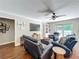 Comfortable living room with leather furniture, hardwood floors, and access to the pool at 404 Broadview Ave, Altamonte Springs, FL 32701