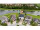 Aerial view of the home nestled in a community with proximity to a scenic pond at 4952 Longmeadow Park St, Orlando, FL 32811