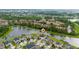 Scenic aerial view of community homes located near a pond at 4952 Longmeadow Park St, Orlando, FL 32811