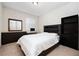 Cozy bedroom features a comfortable bed, dresser, and large window at 4952 Longmeadow Park St, Orlando, FL 32811
