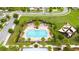 Beautiful aerial view of a community pool with ample space to relax and enjoy a sunny day at 4952 Longmeadow Park St, Orlando, FL 32811