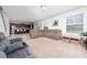 Open-concept living area with comfortable seating, connecting the kitchen and living space at 4952 Longmeadow Park St, Orlando, FL 32811
