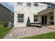 Comfortable outdoor patio seating area is decorated with string lights for evening relaxation at 4952 Longmeadow Park St, Orlando, FL 32811