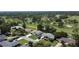 Aerial view of a charming single-Gathering home situated on a golf course community at 550 Eagle Dr, Daytona Beach, FL 32117