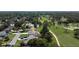 Aerial view of a charming single-Gathering home situated on a golf course community at 550 Eagle Dr, Daytona Beach, FL 32117