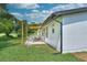 An inviting backyard patio is the perfect spot to enjoy the golf course view and Florida sunshine at 550 Eagle Dr, Daytona Beach, FL 32117