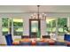 Open dining room view to backyard featuring outdoor seating and expansive lawn at 550 Eagle Dr, Daytona Beach, FL 32117