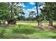 Beautiful golf course view framed by mature trees and lush green grass, creating a serene setting at 550 Eagle Dr, Daytona Beach, FL 32117