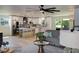 Open-concept kitchen features a large island with seating, stainless steel appliances, and bright lighting at 550 Eagle Dr, Daytona Beach, FL 32117