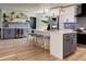 Well-designed kitchen with a bar area with seating, stainless steel appliances, and plenty of counter space at 550 Eagle Dr, Daytona Beach, FL 32117