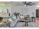 Cozy living room with gray sofas, plants, modern lamps, and a gray area rug at 550 Eagle Dr, Daytona Beach, FL 32117