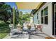 Outdoor patio featuring modern seating, stylish rug, and a sunshade, perfect for relaxation at 550 Eagle Dr, Daytona Beach, FL 32117