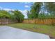 Fenced backyard with mature trees offering shade at 5559 Pats Pt, Winter Park, FL 32792