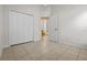 This is an empty bedroom with tile flooring and a large closet with double doors at 5559 Pats Pt, Winter Park, FL 32792