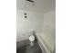 Bathroom featuring white fixtures, including a toilet and bathtub with shower head at 5930 Village Cir # Ge, Orlando, FL 32822