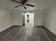 Spacious bedroom with double closets, hardwood floors and neutral paint at 5930 Village Cir # Ge, Orlando, FL 32822