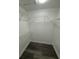 Walk-in closet with built-in wire shelving and new gray floors at 5930 Village Cir # Ge, Orlando, FL 32822