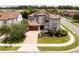 Expansive aerial view of home with tile roof, manicured lawn, and in a well-maintained neighborhood at 682 Canopy Estates Dr, Winter Garden, FL 34787